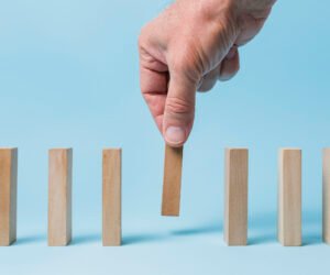 businessman-using-wooden-pieces